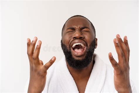 Portrait Of Excited Young African American Male Screaming In Shock And