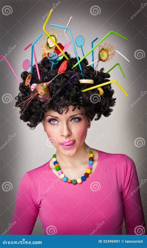 Beautiful Female Model On White Background With Lollipops In The Hair
