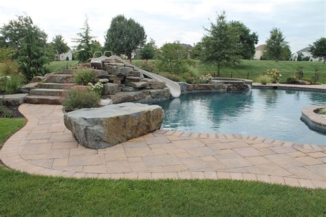 Custom Pool With Diving Rock And Water Flume Aqua Bello Designs