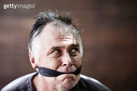Man Gagged With A Strip Of Black Cloth Symbolizes Censorship Silencing