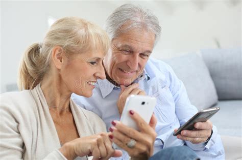 Modern Senior Couple Using Smartphones Stock Image Image Of Pensioner Playful 64951831