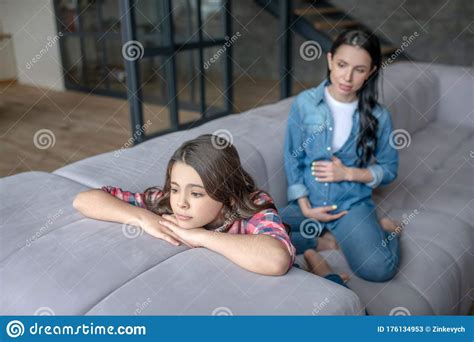 Dark Haired Girl Looking Upset After Talk With Her Pregnant Mom Stock Image Image Of Female