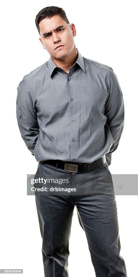 Frowning Young Man Standing High Res Stock Photo Getty Images