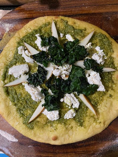 Toasted almonds, crumbled goat cheese, dried cherries and tangy vinaigrette make it amazing. Goat Cheese, Pear And Kale Pizza - Bedlam Farm