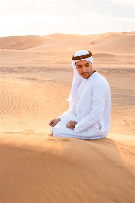 Arabian Man Wearing Traditional Costume In Desert Dubai Uae By Stocksy Contributor Hugh