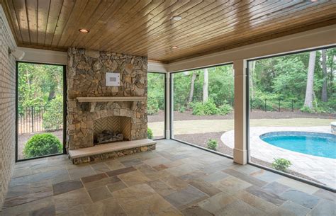 Screened In Porch With Stone Fireplace And Slate Tile All With A View