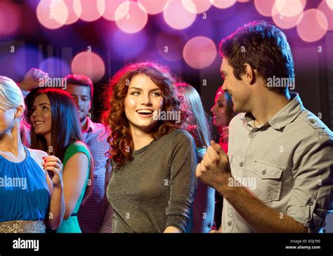 Smiling Friends Dancing In Club Stock Photo Alamy