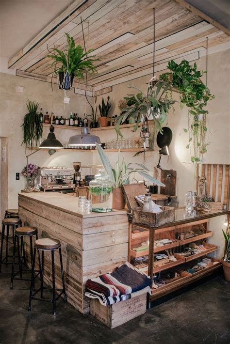 Beautiful And Warm Coffee Shop Interior With Plants Design Shop Café
