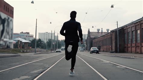 Man Running In Middle Of Street Background Stock Footage SBV Storyblocks