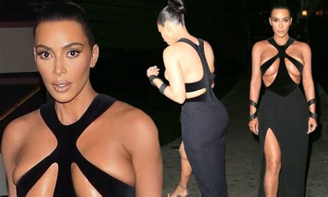 kim kardashian shocks in vintage gown with restrictive cut out sections at the cleavage to