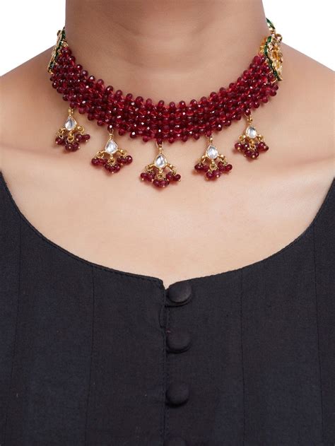 This wrap choker will surely add a glow to any outfit. Buy Red Onyx Gold Plated Kundan Handcrafted Choker ...