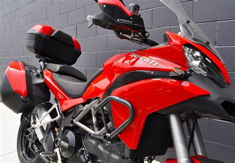 And there is no wonder why as it delivers first class (.) stylish panniers, heated grips and a practical centre stand make it a bike that was born to travel. 2014 Ducati Multistrada 1200 S Touring | Ducati Gold Coast
