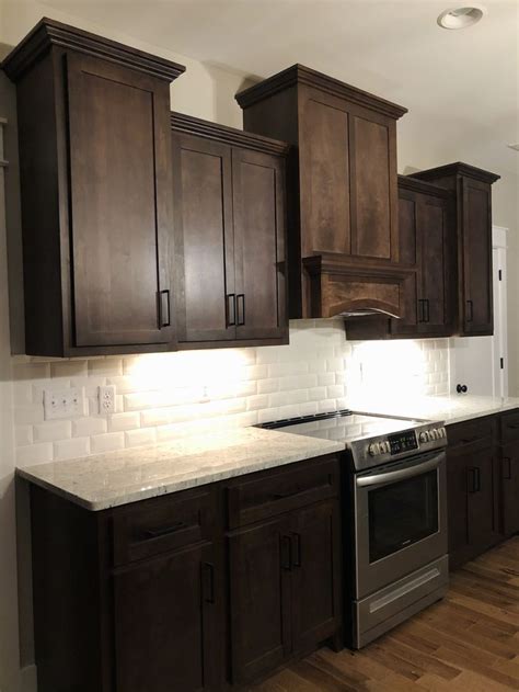 Dark kitchen cabinets with white backsplash | Dark brown kitchen