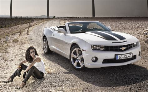 The Sexy Brunette Next To A Chevy Camaro Commercial Photo Wallpaper