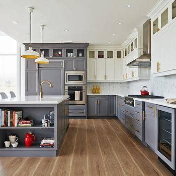 Here the warm undertones of purestyle glacier gray cabinets partner with a purestyle white kitchen island for a fresh, two tone kitchen that is sure to please. White Top Cabinets Gray Bottom Cabinets | Kitchen cabinets color combination, Kitchen remodel ...