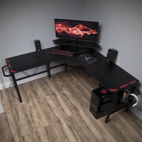 With a black tempered glass desktop. RESPAWN Reversible L-Shaped Gaming Desk & Reviews | Wayfair.ca