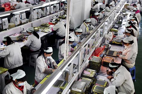 Chinas Factories Try To Shield Workers As Output Revives