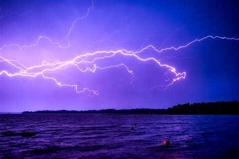 Lightning Across The Sky Over The Water Image Free Stock Photo