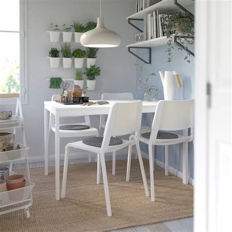 The light and spacious living room features three large windows overlooking the street. VANGSTA / TEODORES Table and 4 chairs - white, white - IKEA