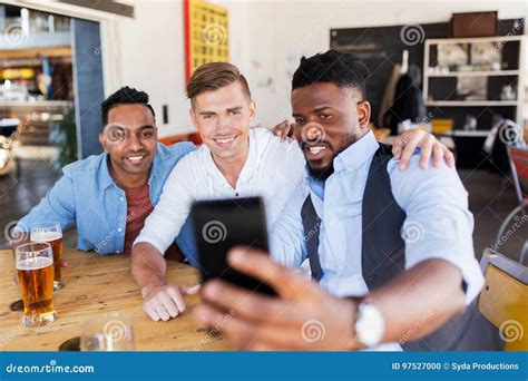 Friends Taking Selfie And Drinking Beer At Bar Stock Photo Image Of