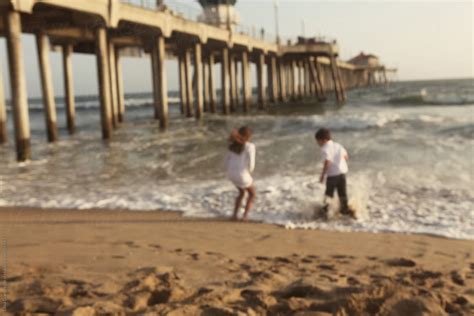 Two Children Playing On Beach By Stocksy Contributor Dina Marie