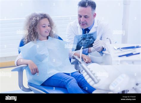 Pediatric Dentist Explaining To Young Patient The X Ray Stock Photo Alamy