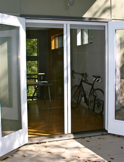 The sliding door screen zips up from the bottom right and across the top for entry. Plisse Double Door Retractable Screen Gallery