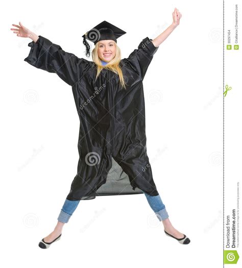 Smiling Woman In Graduation Gown Jumping Stock Photo Image Of