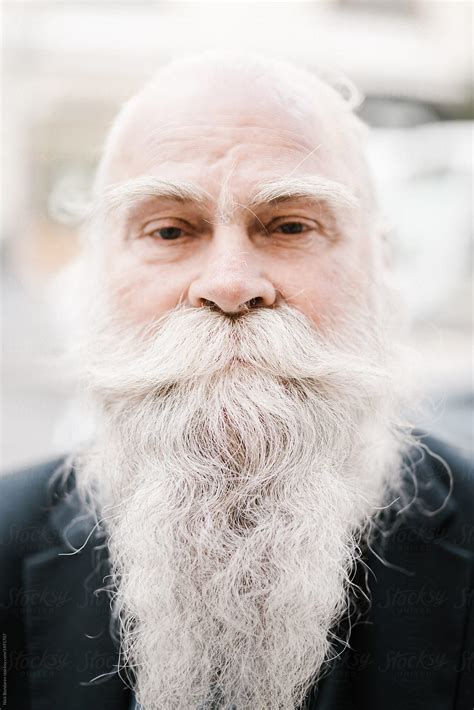 Close Up Portrait Of Old Man With White Gray Haired Beard Looking Like