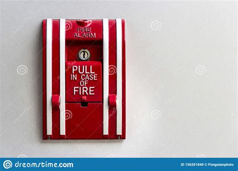 Manual Fire Alarm Red Box Pull On The White Concrete Wall Stock Photo