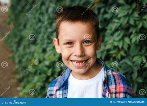 Portrait Happy Smiling Boy Wearing A Checkered Shirt Outdoor Stock