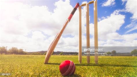 Cricket Bat Ball And Wickets In Cricket Ground High Res Stock Photo