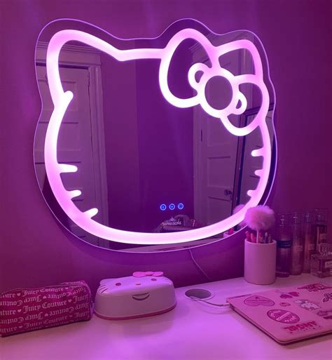 A Hello Kitty Mirror Sitting On Top Of A Desk