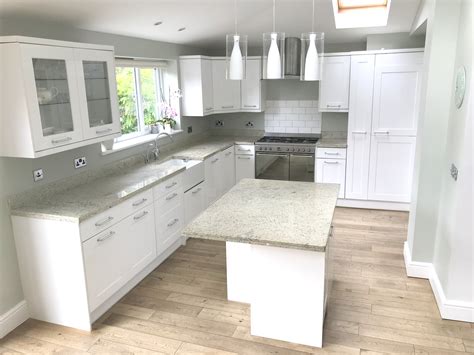 While she admitted they're fading in popularity, they're still a personal favorite of hers. White Gloss Kitchen With Island | The Used Kithcen Company