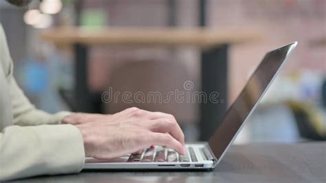 Close Up Of Male Hands Typing On Laptop Side Pose Stock Photo Image