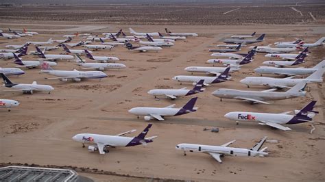 5k Stock Footage Aerial Video Orbit Several Rows Of Cargo Planes In An
