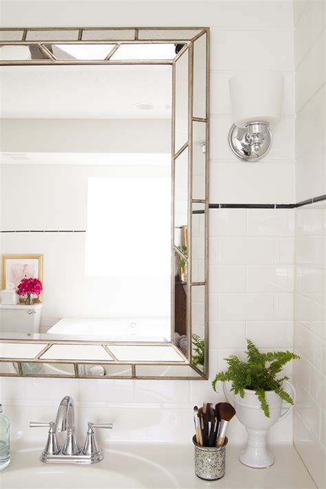 Polished edge bath mirror features sleek, polished edges and a classic frameless design. Bathroom Renovation: A Custom Upgrade on a Budget