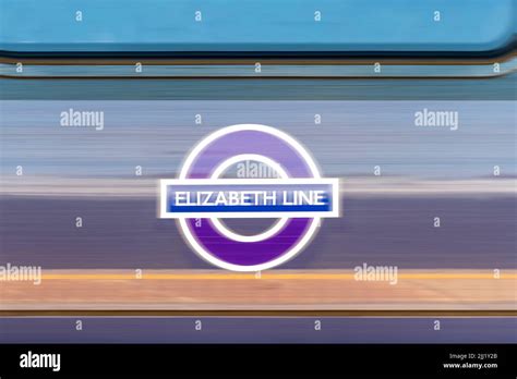 The Elizabeth Line Logo Displayed On The Side Of A Passing Railway