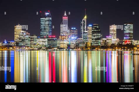 Perth City At Night With The City Lights Reflecting In The Swan River