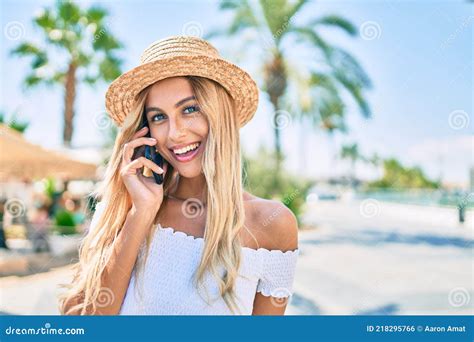 Young Blonde Tourist Girl Smiling Happy Talking On The Smartphone At