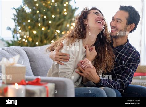 Couple Hugging On Sofa High Resolution Stock Photography And Images Alamy
