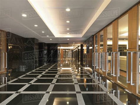 Grand Foyer With Patterned Tile In Apartment Building Lobby Stock