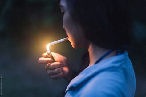 Woman Smoking A Cigarette By Stocksy Contributor Mauro Grigollo Stocksy