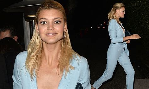 Kelly Rohrbach Flaunts Her Ample Cleavage In A Plunging Jumpsuit