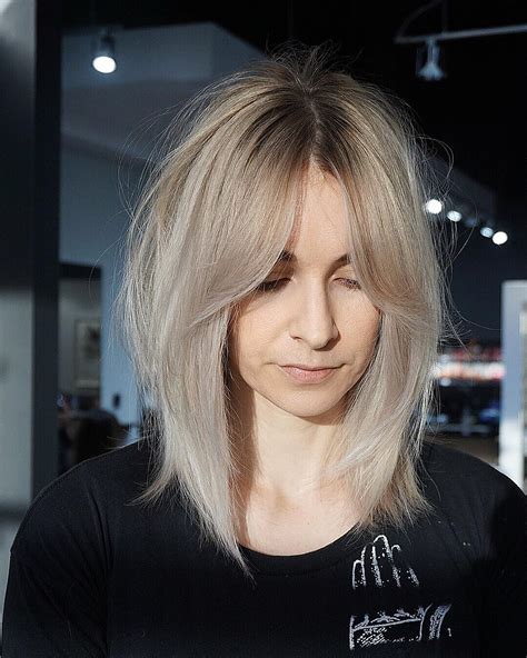 Shaggy Curtain Banged Lob With Undone Straight Texture And Platinum