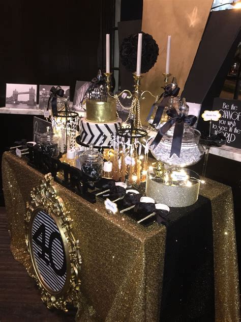Buffet tables are a wonderful furniture piece so incorporated into your home. Black, White and Gold Candy Buffet with a Glamorous 2-tier fondant cake brushed with edible gold ...