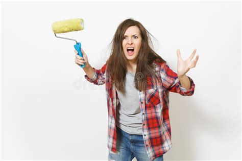 Young Crazy Loony Woman In Casual Clothes Holding Paint Roller For Wall