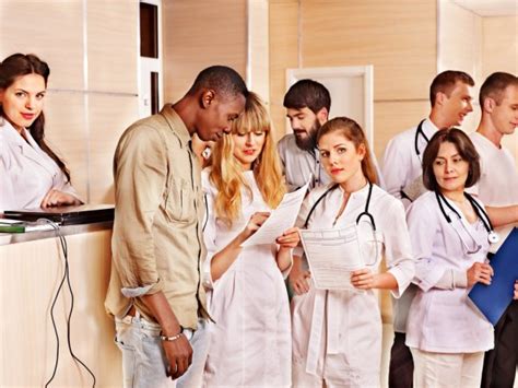 Group Doctors At Reception In Hospital Stock Photo By ©poznyakov 25257001