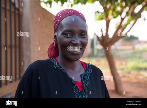 Woman Standing Outside Her Home In Bobo Dioulasso Burkina Faso Africa