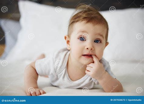 Portrait Of Confused Baby Lying On The Bed Stock Image Image Of